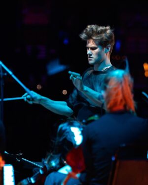 Björk Instagram - @coachella 

conductor @bjarnifrimann 
orchestra : hollywood string ensemble
björk dress @noirkeininomiya 
headpiece @james.t.merry 
bodysuit @solangel 
makeup @isshehungry 
bjarni frímann top @maisonvalentino 
skirt @weishengparis 
styling @eddagud 
photos @santiagraphy 
drone photos @charles.reagan 
mask production @secca_kanazawa 
3D printing support by DMM.make
mask technical direction @suganokaoru 
producer : reiko kunieda.

drone light performance by
@studio.drift 
@dronestories.show 
@twofiftyk 
@novaskystories 
björk creative direction :
björk , @james.t.merry