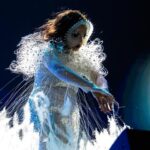 Björk Instagram - @coachella thank you for a magical evening !! conductor @bjarnifrimann orchestra : hollywood string ensemble björk dress @noirkeininomiya headpiece @james.t.merry bodysuit @solangel led sound reacting dress @claradaguin silver skirt @weishengparis makeup @isshehungry bjarni frímann top @maisonvalentino skirt @weishengparis styling @eddagud photos @santiagraphy drone photos @charles.reagan mask design & 3D sculpt @james.t.merry mask production @secca_kanazawa 3D printing support by DMM.make mask technical direction @suganokaoru producer : reiko kunieda drone light performance by @studio.drift @dronestories.show @twofiftyk @novaskystories björk creative direction : björk , @james.t.merry Coachella