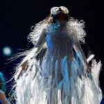 Björk Instagram - @coachella thank you for a magical evening !! conductor @bjarnifrimann orchestra : hollywood string ensemble björk dress @noirkeininomiya headpiece @james.t.merry bodysuit @solangel led sound reacting dress @claradaguin silver skirt @weishengparis makeup @isshehungry bjarni frímann top @maisonvalentino skirt @weishengparis styling @eddagud photos @santiagraphy drone photos @charles.reagan mask design & 3D sculpt @james.t.merry mask production @secca_kanazawa 3D printing support by DMM.make mask technical direction @suganokaoru producer : reiko kunieda drone light performance by @studio.drift @dronestories.show @twofiftyk @novaskystories björk creative direction : björk , @james.t.merry Coachella