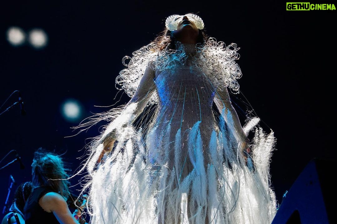 Björk Instagram - @coachella thank you for a magical evening !! conductor @bjarnifrimann orchestra : hollywood string ensemble björk dress @noirkeininomiya headpiece @james.t.merry bodysuit @solangel led sound reacting dress @claradaguin silver skirt @weishengparis makeup @isshehungry bjarni frímann top @maisonvalentino skirt @weishengparis styling @eddagud photos @santiagraphy drone photos @charles.reagan mask design & 3D sculpt @james.t.merry mask production @secca_kanazawa 3D printing support by DMM.make mask technical direction @suganokaoru producer : reiko kunieda drone light performance by @studio.drift @dronestories.show @twofiftyk @novaskystories björk creative direction : björk , @james.t.merry Coachella