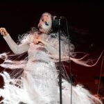 Björk Instagram – @coachella thank you for a magical evening !!
conductor @bjarnifrimann
orchestra : hollywood string ensemble
björk dress @noirkeininomiya
headpiece @james.t.merry
bodysuit @solangel
led sound reacting dress @claradaguin
silver skirt @weishengparis
makeup @isshehungry
bjarni frímann top @maisonvalentino
skirt @weishengparis
styling @eddagud
photos @santiagraphy
drone photos @charles.reagan
mask design & 3D sculpt @james.t.merry
mask production @secca_kanazawa
3D printing support by DMM.make
mask technical direction @suganokaoru
producer : reiko kunieda
drone light performance by
@studio.drift
@dronestories.show
@twofiftyk
@novaskystories
björk creative direction :
björk , @james.t.merry Coachella