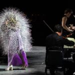 Björk Instagram - thank you @coachella for a wonderful evening !! conductor @bjarnifrimann orchestra : hollywood string ensemble björk dresses @noirkeininomiya headpiece @james.t.merry latex slip dresses @xvenusprototypex bodysuit @solangel hairpiece @tomikono_wig makeup @isshehungry bjarni frimann wearing @jonnycotastudio styling @eddagud mask design & 3D sculpt @james.t.merry mask production @secca_kanazawa 3D printing support by DMM.make mask technical direction @suganokaoru producer : reiko kunieda photos @santiagraphy
