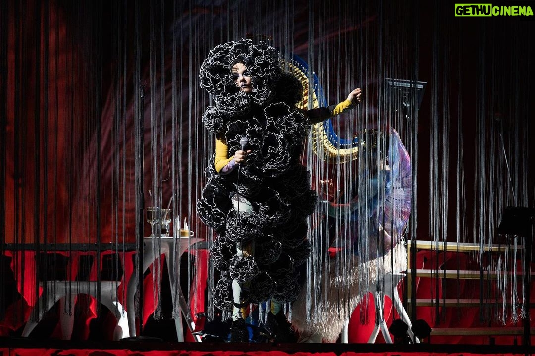 Björk Instagram - thank you tokyo for a great evening and thank you @kasimyn for joining us ! musicians @viibraflutes , @bergurth , @manudelagomusic , @katiebuckleyharpist , @kasimyn choir : @utabito_zanmai_samady photos @santiagraphy björk outfits @noirkeininomiya printed bodysuit @thorastefansdottir kas outfit @tomokoizumi all band outfits @balmain all headpieces @james.t.merry all hairpieces @tomikono_wig makeup @isshehungry styling @eddagud
