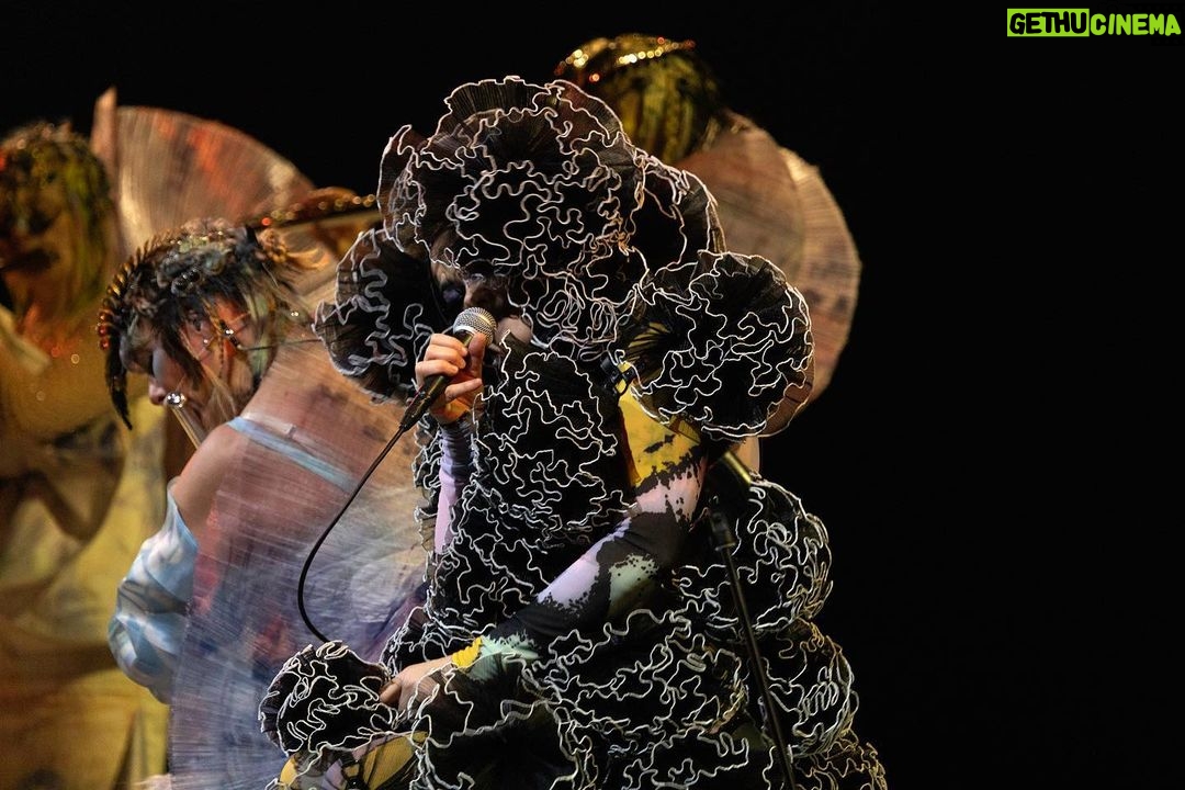 Björk Instagram - thank you tokyo for a great evening and thank you @kasimyn for joining us ! musicians @viibraflutes , @bergurth , @manudelagomusic , @katiebuckleyharpist , @kasimyn choir : @utabito_zanmai_samady photos @santiagraphy björk outfits @noirkeininomiya printed bodysuit @thorastefansdottir kas outfit @tomokoizumi all band outfits @balmain all headpieces @james.t.merry all hairpieces @tomikono_wig makeup @isshehungry styling @eddagud