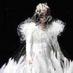 Björk Instagram - thanks for tonight kobe ! conductor @bjarnifrimann orchestra : muroya strings björk dress @noirkeininomiya headpiece @james.t.merry hair @tomikono_wig bjarni frímann top @_julius7officialstore.jp bjarni frímann skirt @black_commedesgarcons x @nike makeup @isshehungry styling @eddagud photos @santiagraphy Kobe, Japan