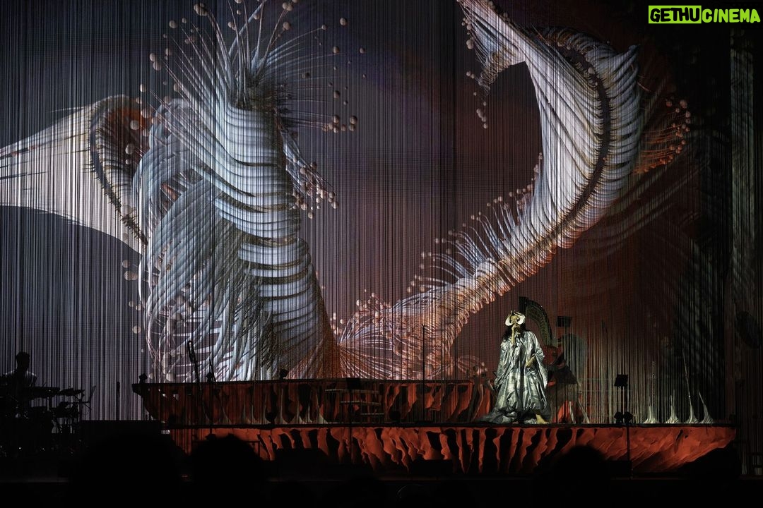 Björk Instagram - thanks for tonight @perthfest ! musicians @viibraflutes , @bergurth , @manudelagomusic , @katiebuckleyharpist choir @voyces_perth photos @santiagraphy björk dress @romancewasborn all band outfits @balmain headpieces @james.t.merry makeup @isshehungry styling @eddagud Perth, Western Australia