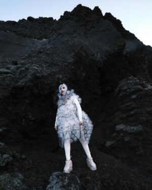 Björk Instagram - i am so honoured to be featured in purple magazine ... it is kinda nuts it is my first time as i recently tidied up my garage and found boxes of old issues ... and strangely enough for some education gave them all to an up and coming photographer in iceland in the middle of covid . the world arranges itself in mysterious and miraculous ways and now few years later that same photographer @vidarlogi is capturing me for the cover in iceland ́s red lava hills .

i would like to thank especially my interviewer @ubi.sunt for initiating this , picking a lush location and an extremely fertile dialogue that is still crocheting it ́s way around my brain ... my inner neurology gently vibrating in the aftershock : i bow , i bow . thanks to @james.t.merry , @eddagud , @joanlbert , @sverrirps , @sunnabjorkmakeup , @steinunnhairstylist for all the help on a sublime day in nature . and to @ozpurple for fighting the integrity fight through decades of keeping niche media relevant and evolving in changing times

@purplefashionmagazine 
outfits @noirkeininomiya 
shoes @grounds.official