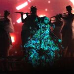 Björk Instagram - thanks for tonight nantes! musicians : @viibraflutes @bergurth @manudelagomusic @katiebuckleyharpist bjork dress @delcoreofficial @danieldelcore latex bodysuit @xvenusprototypex shoes @maisonmargiela floral dress @marni headpieces @james.t.merry musicians outfits @balmain hair @johnvialhair musicians hair @tomikono_wig makeup @isshehungry styling @eddagud photos @santiagraphy Nantes, France
