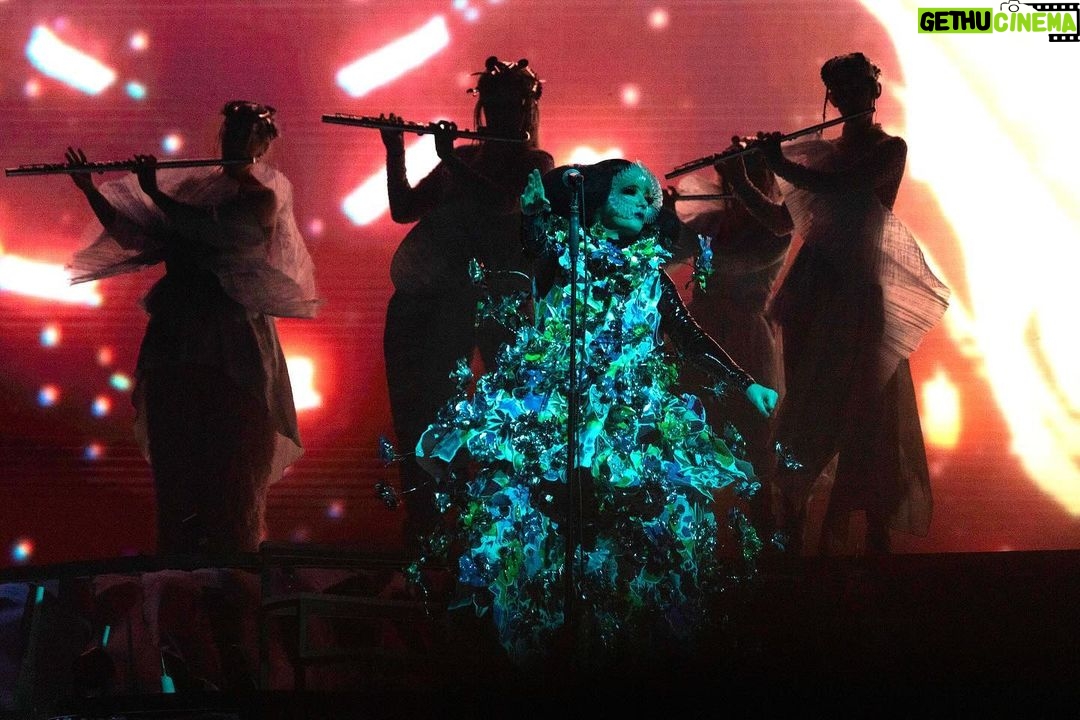 Björk Instagram - thanks for tonight nantes! musicians : @viibraflutes @bergurth @manudelagomusic @katiebuckleyharpist bjork dress @delcoreofficial @danieldelcore latex bodysuit @xvenusprototypex shoes @maisonmargiela floral dress @marni headpieces @james.t.merry musicians outfits @balmain hair @johnvialhair musicians hair @tomikono_wig makeup @isshehungry styling @eddagud photos @santiagraphy Nantes, France