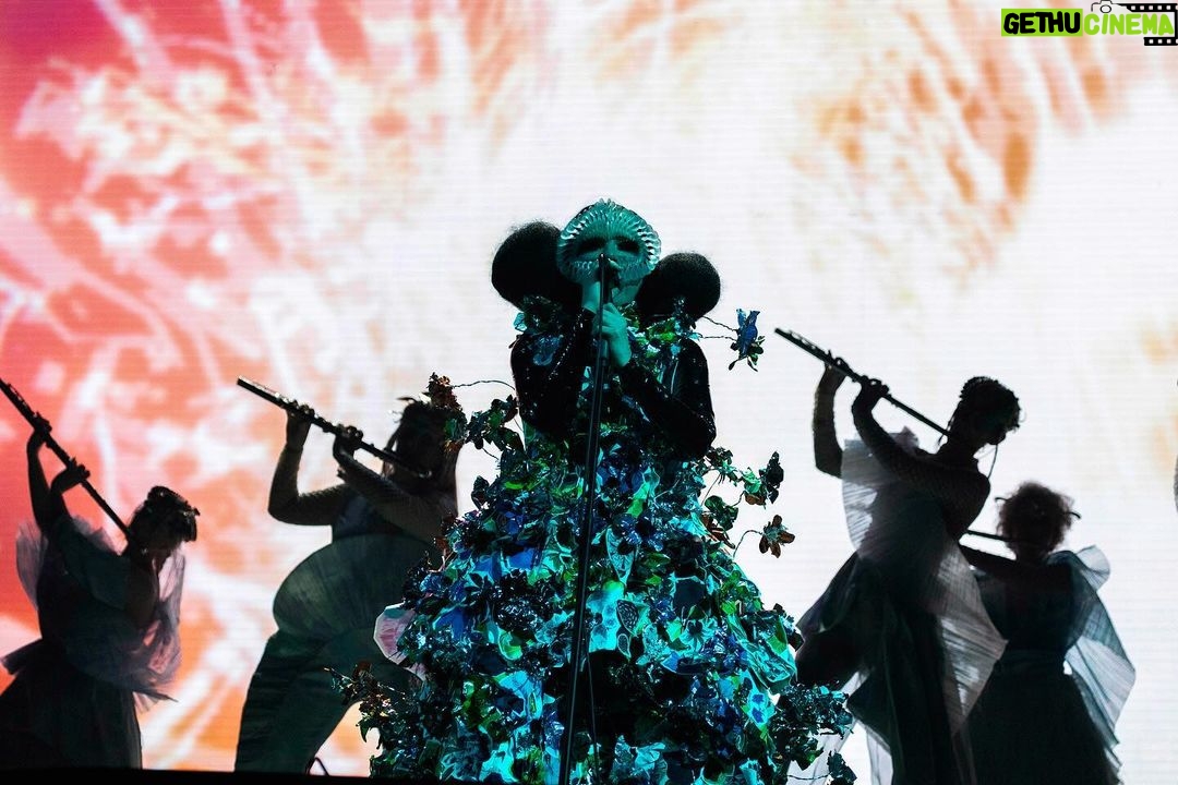 Björk Instagram - thanks for tonight nantes! musicians : @viibraflutes @bergurth @manudelagomusic @katiebuckleyharpist bjork dress @delcoreofficial @danieldelcore latex bodysuit @xvenusprototypex shoes @maisonmargiela floral dress @marni headpieces @james.t.merry musicians outfits @balmain hair @johnvialhair musicians hair @tomikono_wig makeup @isshehungry styling @eddagud photos @santiagraphy Nantes, France