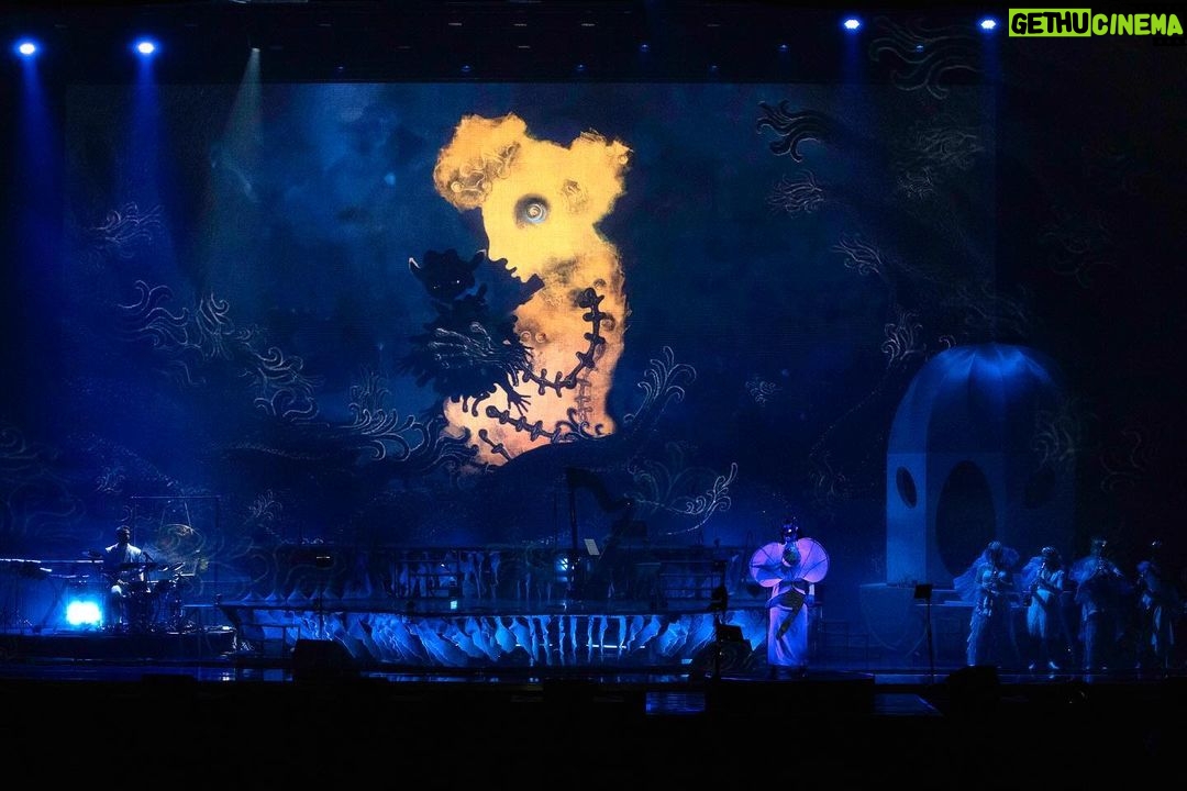 Björk Instagram - thanks for tonight nantes! musicians : @viibraflutes @bergurth @manudelagomusic @katiebuckleyharpist bjork dress @delcoreofficial @danieldelcore latex bodysuit @xvenusprototypex shoes @maisonmargiela floral dress @marni headpieces @james.t.merry musicians outfits @balmain hair @johnvialhair musicians hair @tomikono_wig makeup @isshehungry styling @eddagud photos @santiagraphy Nantes, France