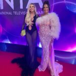 Chloe Burrows Instagram - The funnest night at the NTA’s with @pixibeauty 💖 Styled by @violettafanciesyou assisted by @em.youn Hair by @hadleyyatessalon Make up by @selinabassi Best glam team evaaaaaaa 💅 @laraheems_jewellery for the jewelz @belisshofficial bag @giuseppezanotti shoes @theattico dress ❤️ The O2