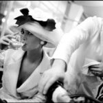 Christy Turlington Instagram - One of many favorite photos by @arthurelgort in honor of his birthday today and one of the best examples of the stories and memories I have working with this legend for nearly 40 years. This image was taken at La Coupole in Paris for @britishvogue in @chanel couture. We were a stealth team, entering the restaurant like customers and ordering wine at the end of the day with a mission to accomplish. The scene was set and we just had to let the moment happen. Working with Arthur meant you had to be ready for the magic of an Elgort moment like this to occur. Happy Birthday, Dear Arthur. ❤️