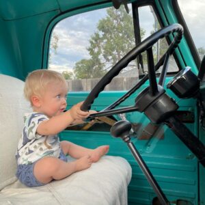 Cody Walker Instagram - He can’t see over the steering wheel or reach the pedals but he’s absolutely determined to drive a manual. That’s my boy! #powerwagon