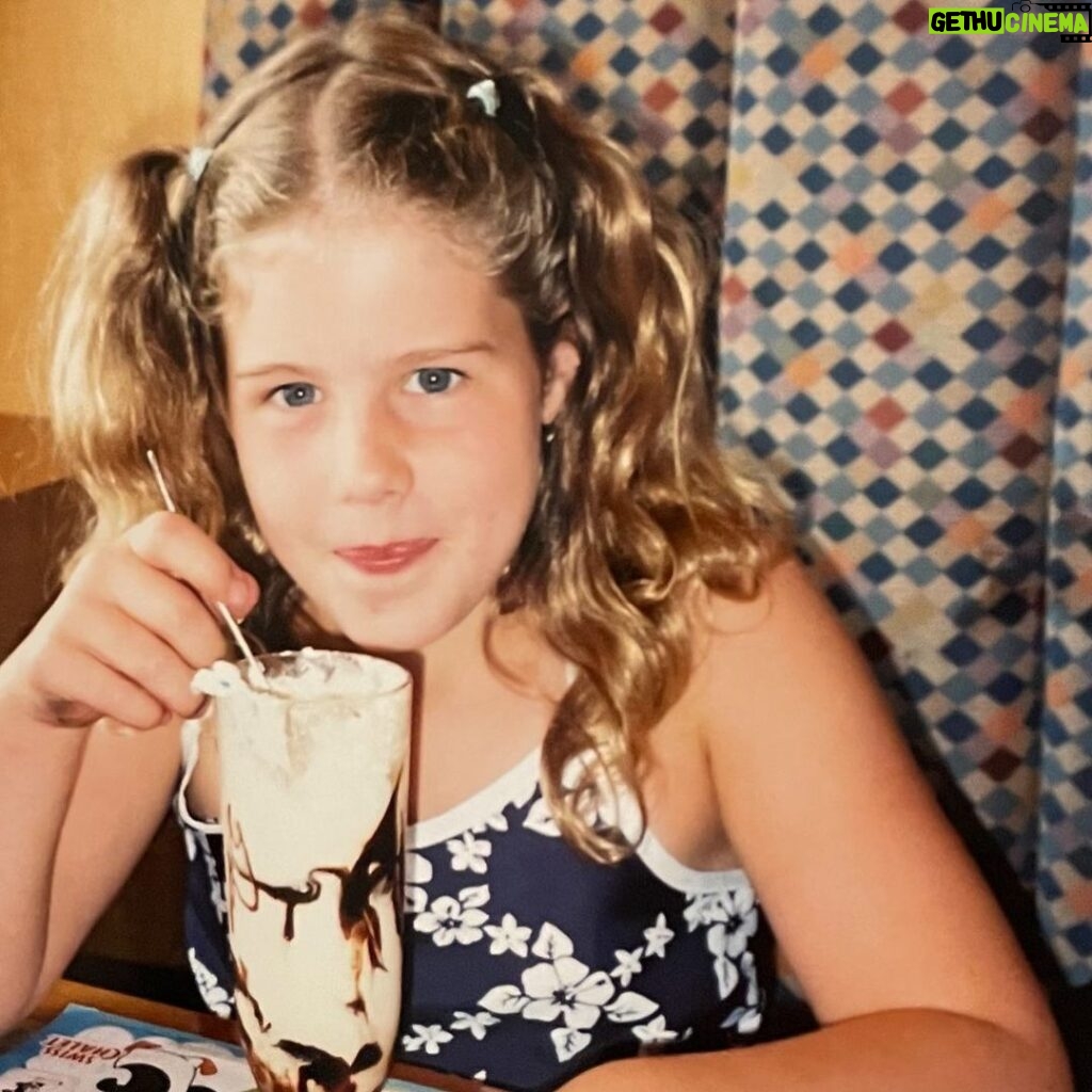 Emily Bett Rickards Instagram - My favourite gourmet meal as a kid was at Swiss Chalet. It involved crayons and a guaranteed overdose in dairy. Here is actual footage of me repping a bathing suit to dinner at a strip mall somewhere in British Columbia enjoying my dream birthday meal and developing lactose intolerance. And though milk is no longer invited to my birthday party you most certainly are! Tip tap the link in bio to join me and my beautiful friend @allymaz as we stretch, flow and empower the rainbow with all our donations going to @itgetsbetter 🏳️‍🌈 🎉 🧘‍♀️ SATURDAY JULY 23rd @ 10 AM PST invite everyone you love including your fur babies! I love love love you all. XX