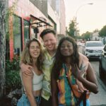 Emily Bett Rickards Instagram - I’ve been in three major US cities in the past two weeks and upon landing I have gotten emotional each time. I’ve wept, I’ve smiled, I’ve skipped. In Detroit there was a rainbow pride flag that greeted me on my way to baggage claim. In Louisville the rainbow was not only on the streets but in every restaurant and store. This past weekend in Philly my friend @coltonlhaynes literary masterpiece Miss Memory Lane was front and centre at the “buy before you fly” section. I have to say I am surprised. HAPPILY surprised! I grew up with strong LGBTQ+ role models in my family and supportive parents but in the past I’ve been told to be “cautious” about my queerness that it could “limit the parts” I might get to play and even a few weeks ago someone close to me was worried the US consulate would ask me about my sexuality and that it might hinder my ability to work in the states. It took me awhile to find myself as part of the Q in the acronym of love and I constantly wonder what it would have been like to have gotten to this knowledge earlier in life. My friend @emrellz and I talk about this ad nauseam but we always end up in the same place - grateful for who we are, who we have become, and immensity grateful for those that helped the rainbow get into the airport, the restaurant and the bookstore. I am also beyond grateful for the friends that have guided me toward being me (two pictured here who I miss the most in this moment), the unwavering patience of my parter and the LGBTQ+ community that without fail is the best this world has to offer. xoxo queer baby 🏳️‍🌈