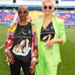 Hannah Waddingham Instagram - #ad Had the best day celebrating some amazing women on the soccer (football😜) field!…alongside my friends at @JohnnieWalkerUS! @WeAreAngelCity and @GothamFC took to the pitch during warm up sporting jerseys designed by the fabulous illustrator @MonicaAhanonu representing a one team approach towards achieving gender equality. The illustrations depict how “we lift each other up as we rise and break through barriers.” Damn right we do! Such a pleasure to stand shoulder to shoulder with Monica and these passionate athletes. The designs are available on the team’s respective websites while supplies last and they will be donating a portion of sales proceeds to Johnnie Walker’s nonprofit partner, @WomensSportsFoundation, to expand access and opportunities for women in sport to compete and lead… without barriers and it’s my pleasure to be here to shout about it! More from me and the dedicated team at Johnnie Walker soon! X #KeepWalking