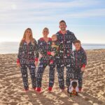Heather Rae El Moussa Instagram - It wouldn’t be a California Christmas without onesies on the beach 🥰 Our whole heart right here 🫶🏻🌲 Newport Beach, California