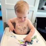 Heather Rae El Moussa Instagram - The messiest, silliest, happiest boy who brings us so much joy 🤍His smile makes me smile 🥹 Our little Picasso!! Newport Beach, California