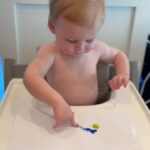 Heather Rae El Moussa Instagram - The messiest, silliest, happiest boy who brings us so much joy 🤍His smile makes me smile 🥹 Our little Picasso!! Newport Beach, California