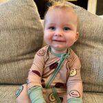 Heather Rae El Moussa Instagram - Friday mood: 😜 I blinked and he’s already sitting up all by himself, smiling for the camera giggling non-stop, and he has two teeth that came in & 2 more piercing through 🥹 Swipe for cuteness 🤍
