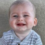 Heather Rae El Moussa Instagram - Friday mood: 😜 I blinked and he’s already sitting up all by himself, smiling for the camera giggling non-stop, and he has two teeth that came in & 2 more piercing through 🥹 Swipe for cuteness 🤍