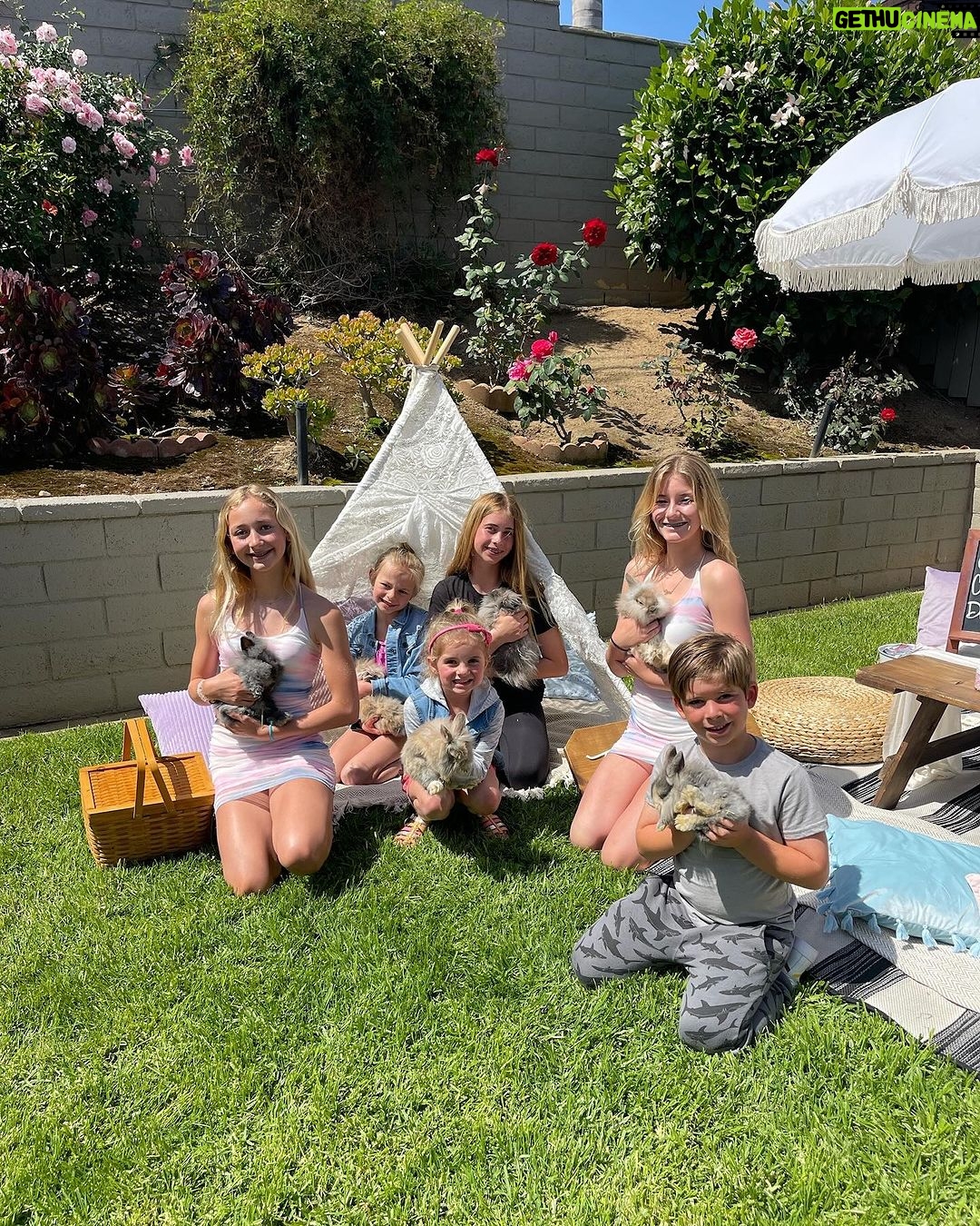 Heather Rae El Moussa Instagram - Wow life goes by so fast! It’s a rainy cozy day & we are going through old Easter pics through the years and reminiscing and reminding ourselves to savor the moments good and bad. Love our little bunnies 🐰 Swipe through- Most recent and going back to 2020