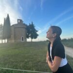 Isabel Oli Instagram - This tranquil scenery has captured my heart… aaaand him as well 🤍🤣 #TravelWithThePratties #Tuscany Chapel of Our lady of Vitaleta