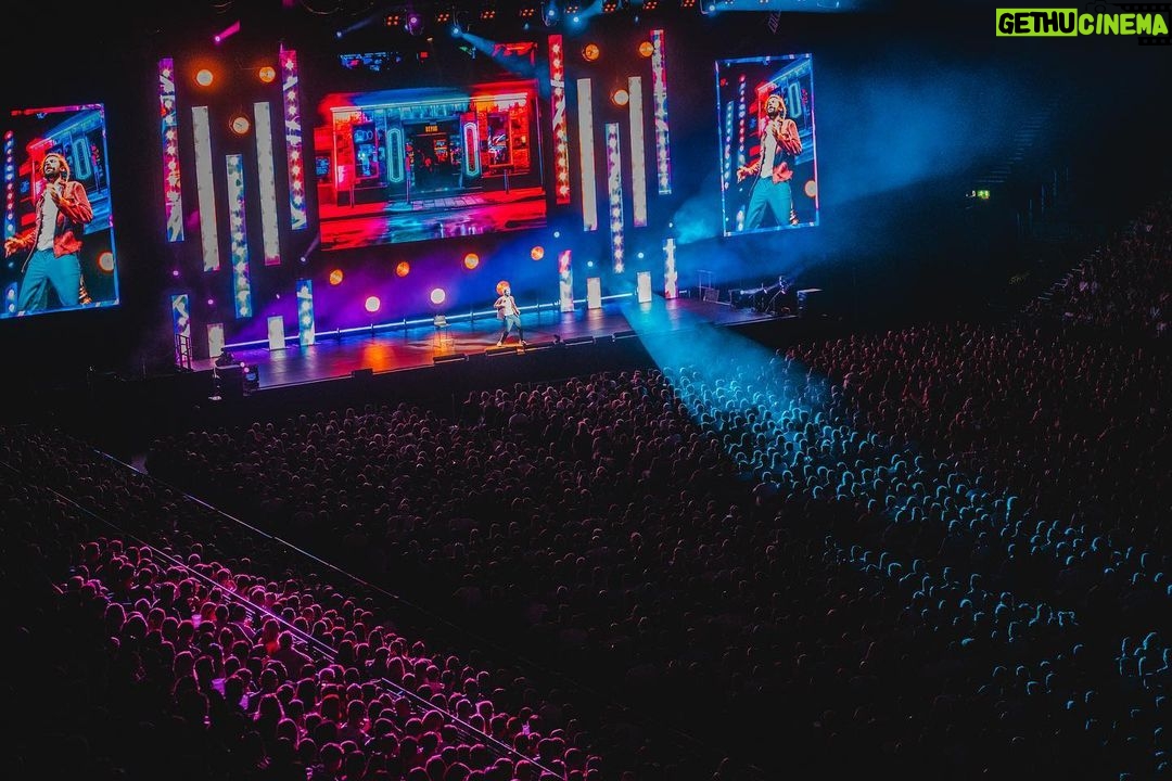 Jack Whitehall Instagram - First leg of the arena tour done. 👊 thanks to everyone who has come along thus far. Honestly some of the best crowds I’ve ever played to. 🙏 Also looking through @andrew_takes_photos_ photos and I have to say a big shout out to the team who designed it for me. It looks epic! I said I wanted it to have some visual impact and they have done me proud. Kudos to @mostlytom @vinchenzospoonjanja @johndodkin @_lukeavery Off to US for a week then back for some fun at @utilitaarenabirmingham @cardiffinternationalarena @nottinghamarena and then the big finale at @theo2london 😎🙌