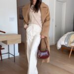 Jamie Chung Instagram - GRWM Knitted shirt @seanewyork Jeans @madewell Cream pants and sweater @oscar_the_collection Coat @elleme Bag @manu_atelier