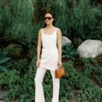 Jamie Chung Instagram - Friday vibes but realistically in sweatpants by 4pm 📸 @janawilliamsphotos_ @meliebianco bag @the.wolf.gang pants @alevimilano shoes @dionlee top @paradigmeyewear Sunnies