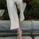 Jamie Chung Instagram - Friday vibes but realistically in sweatpants by 4pm 📸 @janawilliamsphotos_ @meliebianco bag @the.wolf.gang pants @alevimilano shoes @dionlee top @paradigmeyewear Sunnies