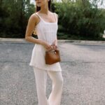 Jamie Chung Instagram - Friday vibes but realistically in sweatpants by 4pm 📸 @janawilliamsphotos_ @meliebianco bag @the.wolf.gang pants @alevimilano shoes @dionlee top @paradigmeyewear Sunnies