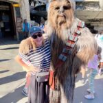 Jenna Fischer Instagram - We took the kids but Mom and Dad had just as much fun! My favorite rides are Cars Radiator Springs Racers and Soarin’ in Disney California Adventure Park. Splash Mountain and Rise of the Resistance in Disneyland Park. (@angelakinsey I know how happy you are that I got a photo with Chewbacca.) Oh and both parks are decorated for Halloween right now. I love it! (I’m a nerd for Holiday decor 🎃) Head to my stories to see more of our day at @disneyland @disneyparks Disney Land/California Adventure Park/Downtown Disney.