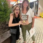 Jenna Fischer Instagram - I cherish this photo! I got to meet my baking mentor @alchemybread (I guess 2023 is when I finally get to meet all my baking crushes). Yes, I brought my cookbook for her to sign. Yes, I was nervous. Yes, she’s amazing. Yes, learning to bake bread using her cookbook changed my life. That is not hyperbole. Bread making requires focus and patience and it became a kind of spiritual/ritual experience for me that allowed time and space for me to think and reevaluate my goals in life. It all started with her cookbook, a digital scale, a thermometer, flour, water and salt. 🥖❤️