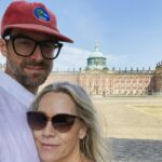 Jennie Garth Instagram – Berlin Day 2 
Dave and I love to travel. It brings us together in a way like none other. We spend the days wandering. No plan. No distractions. No expectations. No one I’d rather get lost with than you babe❤️. 1) I live for lakes  2) I googled ‘places to eat on a lake’ which led us to a deserted dock with a rusty bell hanging in a tree. I clanged it of course. This boat came for us, and we just got on it! 3) Dave ate some meat things on a private island. I ate some non-meat things. 4) We took the boat back to shore. 5) We have an extensive collection of long arm selfies from wherever we end up. 6) Porsche in Berlin.  7) Quiet lake side moments like this are good for the soul. 8) The deserted dock. 9) German architecture is gorgeous. 10) Hours of drives like this…no idea where we are headed next! 
#travel #love Germany