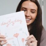 Jess Conte Instagram - as a lifelong lover of journals - i’m so excited to announce i created my dream guided journal!!!! meet Day By Day: 100 Ways To Capture Memories & Create Your Own Story 🥲💛 it’s out for preorder now, the link is in my bio! head to my stories for a more in depth explanation 🤭