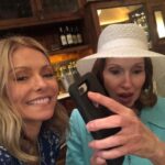 Kelly Ripa Instagram - A rare birthday photo of my mom in her natural habitat, trying to block me from taking her picture with her phone. Amateur move! Happy birthday mom! I love you 🎂♥️🎂🤡😵‍💫