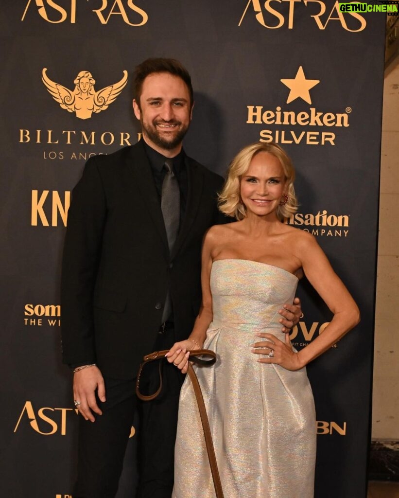 Kristin Chenoweth Instagram - family night out at the #astraawards!! 💖 #theastras @hollywoodcreativealliance Dress: @christopherjohnrogers Shoes: @gianvitorossi Jewelry: @swarovski & @considerthewldflwrs Thunder’s Outfit: @christiancowan Styles by @debswatson