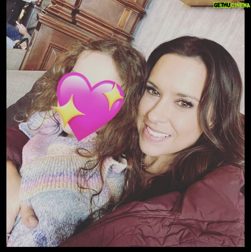 Lacey Chabert Instagram - My favorite days on set are when I get to sneak away at lunch and cuddle this little love bug 💕