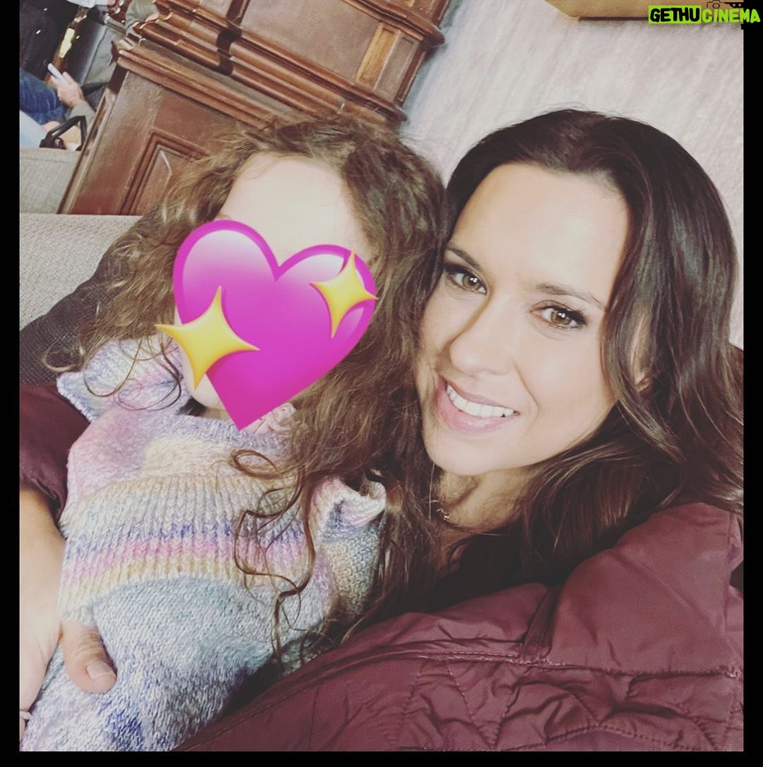 Lacey Chabert Instagram - My favorite days on set are when I get to sneak away at lunch and cuddle this little love bug 💕