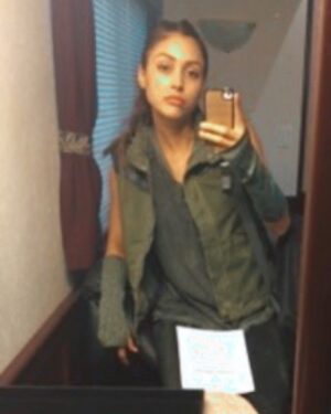 Lindsey Morgan Instagram - This is a never-before-seen-trailer-selfie on my first day of THE 100 as Raven Reyes.
Note the hella old iPhone, awkward crab hand and baby me trying desperately to “look”, “feel” and “be” Raven Reyes Tough.
I look at this photo and see a girl who is nervous as all hell...terrified, excited...and full of something to prove.
She didn’t have the best experience on her last job & was doubting herself, doubting her abilities, doubting her path.
But I also see a girl who is full vigor, full of TRY & full of her dreams & that small voice inside of her who’ll never let her quit.
.
.
.
Raven Reyes,
You always brought out the best parts of me. The strength in me; the intellect, the resourcefulness, the resilience. The sass. 
I didn’t know how strong I was until I had to find out how strong you are. 
Over the past seven years, it was a privilege to learn you as I began to learn myself...as an artist, as a woman and as the person I aspire to be in this world.
You taught me things I never thought I’d learn in my 20’s; how to change my oil, how to weld, splice wires and eradicate brain eating A.I.s.
You taught me immeasurable pain...physically, mentally, emotionally. 
Taught me the true cost of loss & the extent humanity & myself will go to survive. You tested me, humbled me & broke me.
Yet, like a phoenix (or perhaps a Raven) you always rose from the ashes; renewed, evolved, ready to rebuild.
You never quit.
You never quit & because of that I never did.
Thank you for teaching me there’s always a way, that I’m always smarter & stronger than I think, there’s always light in the darkness & there’s always love...even at the end of the world. There is always love.
That I deserve love, deserve second chances, deserve happiness & deserve the family of my choice. 
Thank you for teaching me that my battle scars don’t define me, but instead brilliantly decorate my ever-evolving, ever-learning and ever-experiencing human soul.
Your grace and grit transcended myself, & I’m better because of that ...& because of you.
Thank you Raven Reyes.
May we meet again.
.
.
.
So many more thank yous to give. To the @cw_the100 , to @warnerbrostv to @rothenberg.jason , to...CONT IN COMMENTS