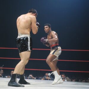 Muhammad Ali Instagram - Muhammad Ali in action vs George Chuvalo during a fight at the Maple Leaf Gardens. ⁣ ⁣ Toronto, Canada ⁣ March 1966.⁣ ⁣ 📸: @neilleiferphotography⁣ ⁣ ⁣ ⁣ #MuhammadAli #Icon #GeorgeChuvalo #Toronto #1966 #MapleLeafGardens #NeilLeiferPhotography #BoxingGreats #HistoricBout