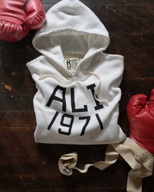 Muhammad Ali Instagram - The Birth Of Boxing's Greatest Rivalry.⁣
Ali v Frazier | FOTC | New Arrival.⁣
⁣
“It was more than just a fight; it was an event, one that captured the imagination not just of the fight crowd, but of the entire world.” –Bert Sugar⁣
⁣
March 8, 1971. Muhammad Ali and Joe Frazier came together in the heart of Manhattan in a moment of truth. Given the dimensions of the day, both heavyweights represented much more than their own flesh and blood. The undefeated Ali, who at 25 years old had been stripped of his heavyweight title for refusing to register in the draft, was back at the doorstep of greatness after a three-year suspension. The undefeated Frazier, who was cast by many as a villain in the lead-up, the indestructible force that had pulled up residence in his absence. ⁣
⁣
This was champion versus champion, but also a crucible of the times. It was called the “Fight of the Century.” ⁣
 ⁣
@rootsoffight throws back to boxing’s most iconic event with this new ivory FOTC hoody!⁣
⁣
Ali x FOTC - By @rootsoffight | Link in story!⁣
⁣
⁣
#MuhammadAli #RootsofFight #KnowYourRoots