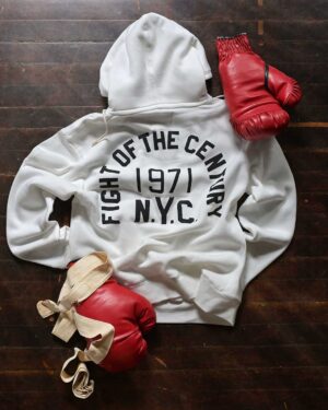 Muhammad Ali Instagram - The Birth Of Boxing's Greatest Rivalry.⁣
Ali v Frazier | FOTC | New Arrival.⁣
⁣
“It was more than just a fight; it was an event, one that captured the imagination not just of the fight crowd, but of the entire world.” –Bert Sugar⁣
⁣
March 8, 1971. Muhammad Ali and Joe Frazier came together in the heart of Manhattan in a moment of truth. Given the dimensions of the day, both heavyweights represented much more than their own flesh and blood. The undefeated Ali, who at 25 years old had been stripped of his heavyweight title for refusing to register in the draft, was back at the doorstep of greatness after a three-year suspension. The undefeated Frazier, who was cast by many as a villain in the lead-up, the indestructible force that had pulled up residence in his absence. ⁣
⁣
This was champion versus champion, but also a crucible of the times. It was called the “Fight of the Century.” ⁣
 ⁣
@rootsoffight throws back to boxing’s most iconic event with this new ivory FOTC hoody!⁣
⁣
Ali x FOTC - By @rootsoffight | Link in story!⁣
⁣
⁣
#MuhammadAli #RootsofFight #KnowYourRoots