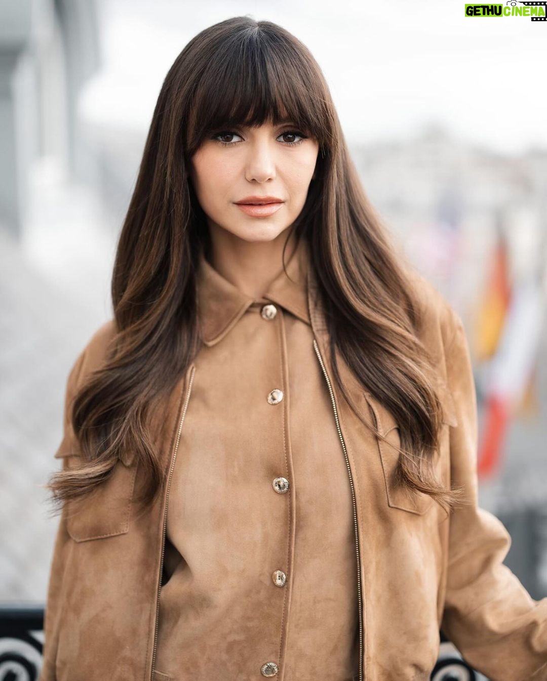 Nina Dobrev Instagram - Last week, @nina jetted to Paris for @miumiu’s fall/winter ‘24 show, an event that saw celebs like Emma Corrin, Lorde, Sydney Sweeney, and Joey King mingling in the front row. A #PFW regular, traveling overseas is always a treat for the former #VampireDiaries and #Degrassi star. “My favorite part is exploring Paris because, after all, the city is also a runway, and I love to use being here as an excuse to dress up a little more then usual,” she tells @_jonathanborge. “I love how young and fresh Miu Miu feels as a brand. It’s playful yet sophisticated with an edge.” At the link in bio, how she got ready for the show, and why hip-hop’s always on her getting-ready playlist. 📸: @tiziano.raw