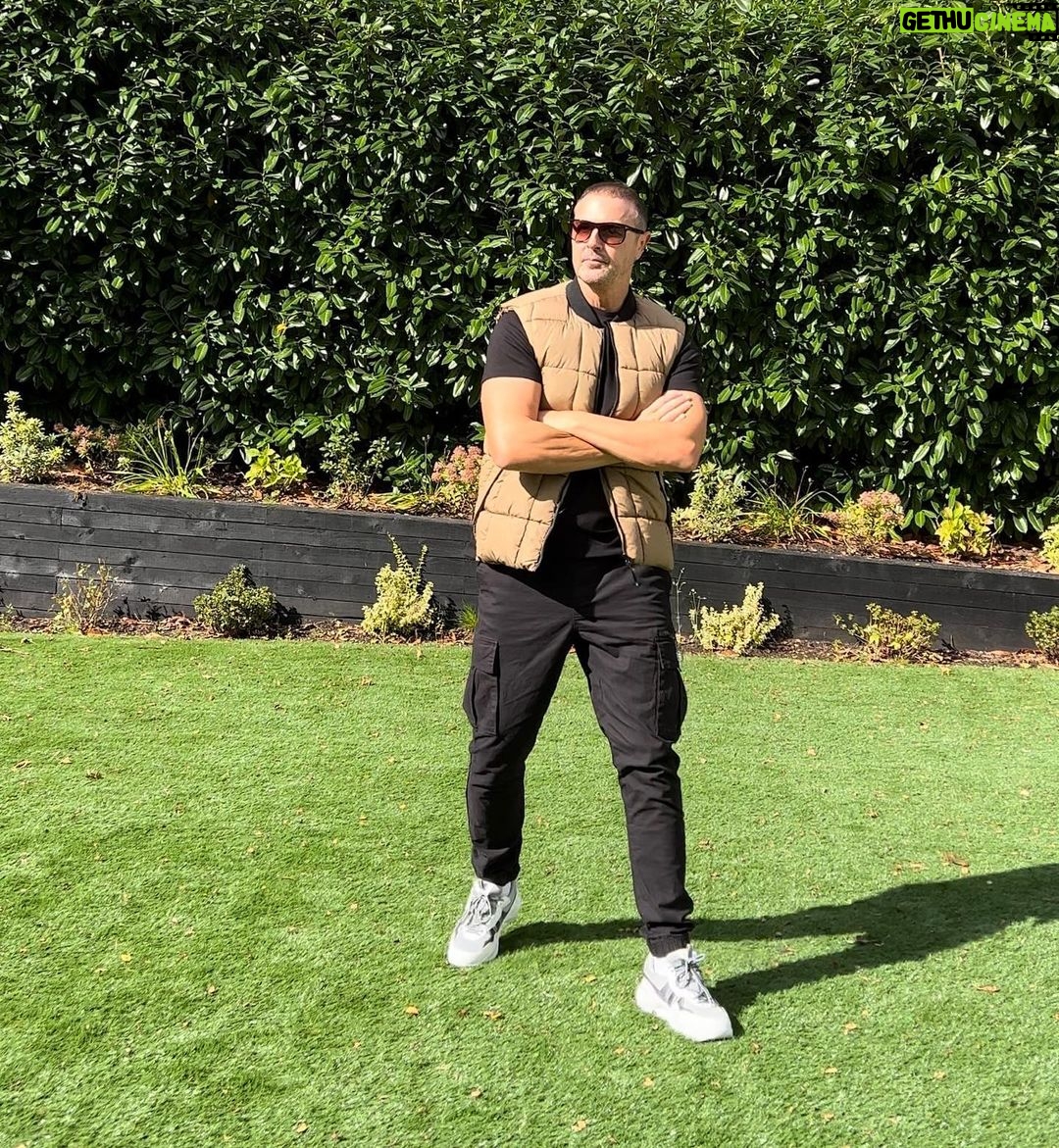 Paddy McGuinness Instagram - Gazing pensively into the middle distance, pushing biceps, the obligatory holding of sunglasses and my £20 quid body warmer. Now we’re modelling!!! @davidgandy_official #natural #vogue #modellife #elitemodel #bornwithit #boltonbeauty