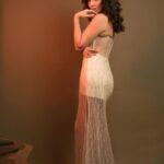 Pooja Chopra Instagram - It’s all about the details! Our ivory corset dress features exquisite embroidery that’s sure to turn heads. Ready to make a statement? @poojachopraofficial in our pearl and crystal embellished tulle corset dress with a slit on the side. Website: www.babitam.com Message/ video call on: +91 9819737215 Flagship Store: 5, Gautam Ashish, V. Mehta Road, Juhu- Vile Parle, Mumbai- 400069 #babitam #meermoti #vintageglam #celebrity #ivory