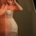 Pooja Chopra Instagram - It’s all about the details! Our ivory corset dress features exquisite embroidery that’s sure to turn heads. Ready to make a statement? @poojachopraofficial in our pearl and crystal embellished tulle corset dress with a slit on the side. Website: www.babitam.com Message/ video call on: +91 9819737215 Flagship Store: 5, Gautam Ashish, V. Mehta Road, Juhu- Vile Parle, Mumbai- 400069 #babitam #meermoti #vintageglam #celebrity #ivory