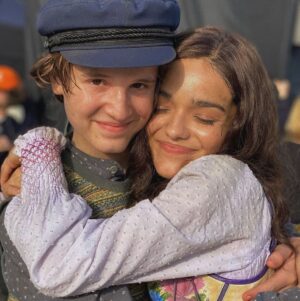 Rachel Zegler Instagram - a lil toast to my lil tribute babies (+ my baby cousin maude ivory), who made me a big sister (or just a regular sister… i know some of y’all are older it’s ok we’re ok calm down) and made me feel the happiest i ever have on a set before. the support amongst this cast is so real, and it’s been the best time ever to watch my fellow tributes on the big screen. and even better to share this moment with them. the number one movie in the world?!?!? these tributes are the reason. they’re so absolutely incredible and i love them all madly. DO ME A FAVOR: go out and see them in theaters this weekend. 🩷🐍🕊️

(i know some of you aren’t pictured but i am tagging you anyway because i love you so much.)

also that last photo is the reality of working on the set of the hunger games. mannequins EVERYWHERE.